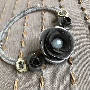 Bead and metal flower choker style necklace